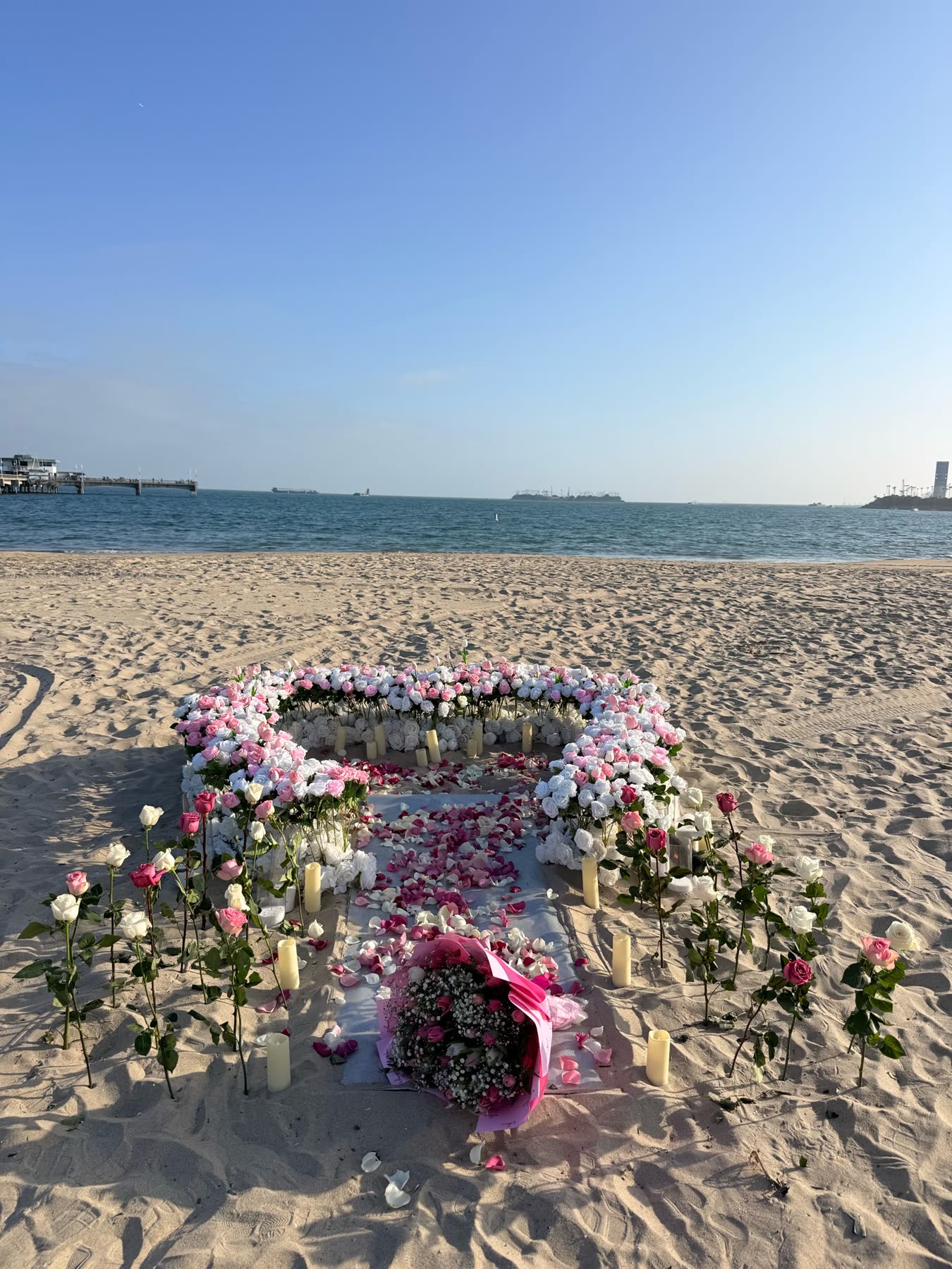 Ground rose heart with a floral entrance on the beach